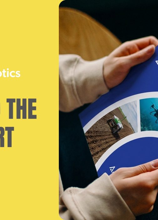 A reader holding a copy of A Robotics Roadmap for Australia 2025, published by Robotics Australia Group